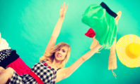 Girl Throwing Clothes in Air